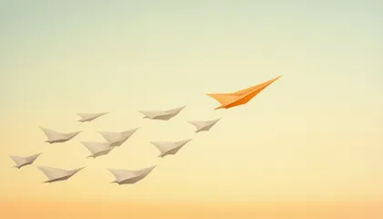 Un avion en papier orange ouvre la voie devant une nuée d'avions en papier blancs qui le suivent